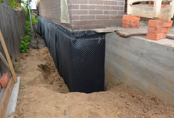Happy homeowners after waterproofing job in Gratiot